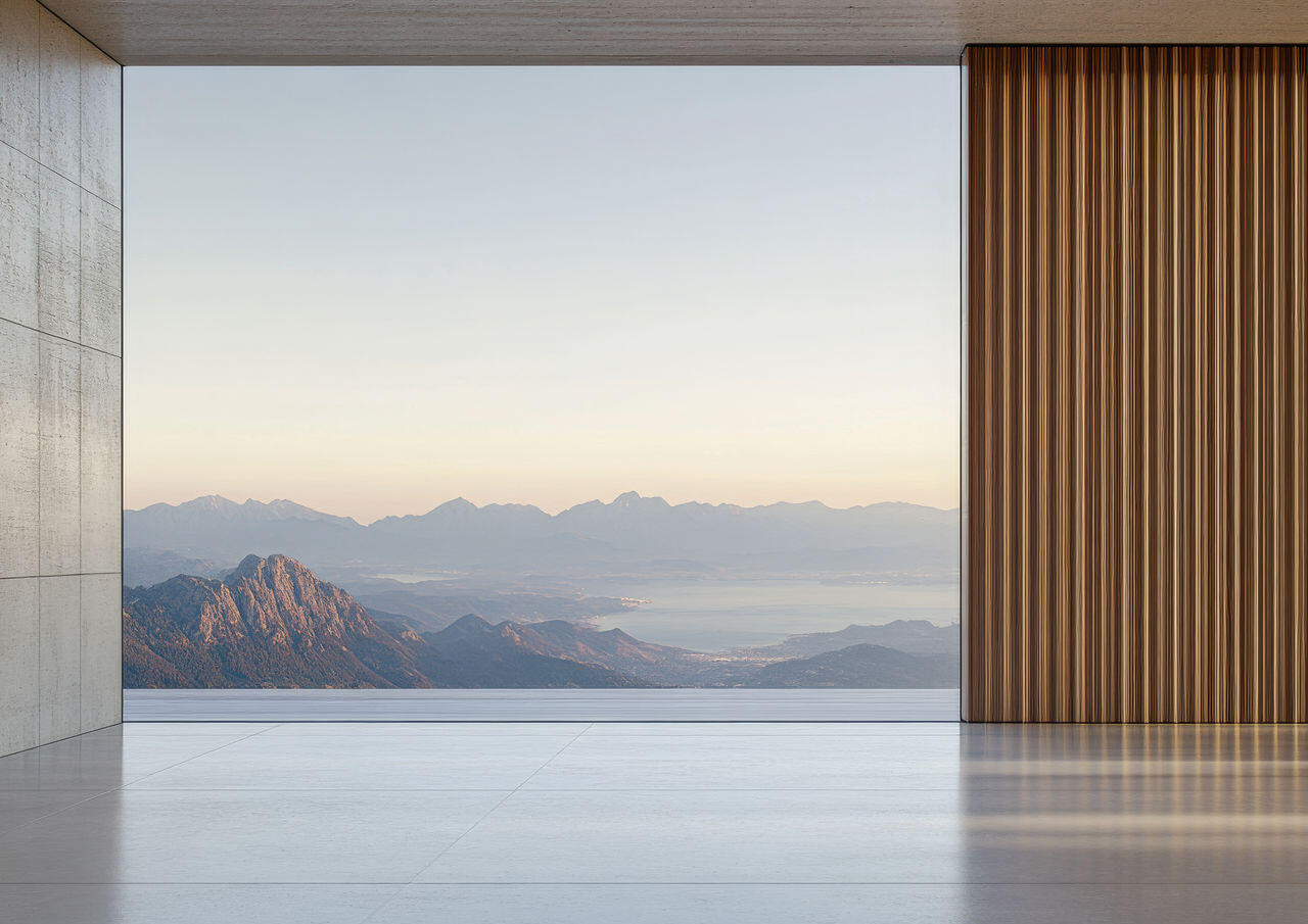 Minimalist interior with panoramic mountain view, reflecting the clarity and focus of minimal microsites in creative branding featured in Art+Media+Design Journal.